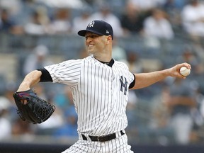 New York Yankees starting pitcher J.A. Happ pitches in the first inning of a baseball game against Toronto Blue Jays, Sunday, Aug. 19, 2018 in New York.