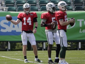 New York Jets quarterbacks Sam Darnold, left, Teddy Bridgewater, center, and Josh McCown participate during practice at the NFL football team's training camp in Florham Park, N.J., Monday, Aug. 6, 2018.