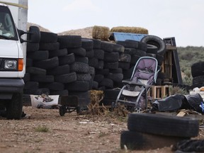 This Aug. 5, 2018 photo shows debris outside the location where people camped near Amalia, N.M.