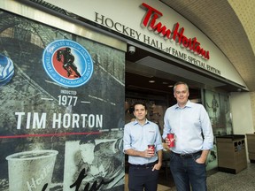 Alex Macedo, left, president at Tim Hortons and Duncan Fulton, chief operating officer at Restaurant Brands International pose for a photograph at the Hockey Hall of Fame Tim Hortons location in Toronto on Thursday, August 16, 2018.