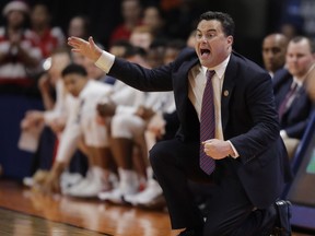 FILE - In this March 15, 2018, file photo, Arizona coach Sean Miller calls out during a first-round game against Buffalo in the NCAA men's college basketball tournament in Boise, Idaho. When specifics about Title IX reporting requirements were added to Miller's contract this year, the school said to expect similar language in its other coaching contracts.