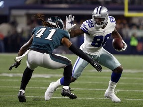 File-This Nov. 19, 2017, file photo shows Philadelphia Eagles cornerback Ronald Darby (41) defends as Dallas Cowboys' Dez Bryant gains extra yardage after catching a pass in the first half of an NFL football game in Arlington, Texas. Browns wide receiver Jarvis Landry says he would love for Bryant to join him in Cleveland. Landry said Monday, Aug. 13, 2018, that he has been in touch with Bryant, a three-time Pro Bowler who was released in April by the Dallas Cowboys.