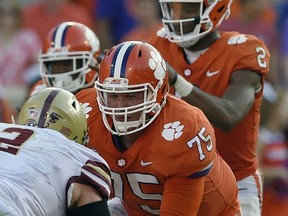 FILE - In this Sept. 23, 2017, file photo, Clemson's Mitch Hyatt (75) battles Boston College's Zach Allen as he protects quarterback Deshaun Watson (2) during the second half of an NCAA college football game in Clemson, S.C. Hyatt was selected to the AP Preseason All-America team, Tuesday, Aug. 21, 2018.