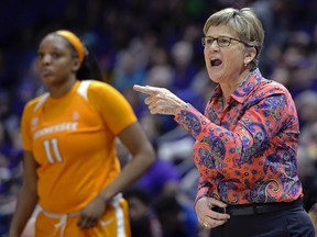 File-This Jan. 28, 2018, file photo shows Tennessee head coach Holly Warlick, right, shouting instructions to her players as center Kasiyahna Kushkituah (11) watches in the fourth quarter of an NCAA college basketball game in Baton Rouge, La. Warlick has received a three-year contract extension. Athletic director Phillip Fulmer announced Friday, Aug. 10, 2018, that Warlick's contract now runs through the 2021-22 season. Warlick's deal was set to expire at the end of the 2018-19 season. Fulmer said in a statement "there is no one better suited to lead what is one of the most unique and tradition-laden programs in the sport."