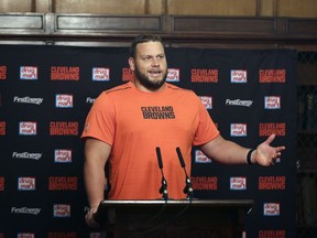 FILE - In this Oct. 27, 2017, file photo, Cleveland Browns offensive lineman Joel Bitonio speaks during a press conference following a training session in Bagshot, England. Bitonio would rather not be the one to try and fill Joe Thomas' legendary shoes. One of the NFL's top left guards, Bitonio is content staying at that position unless the Browns need him to slide over and replace Thomas, the 10-time Pro Bowl tackle who retired after last season, leaving a massive hole in Cleveland's line and locker room.