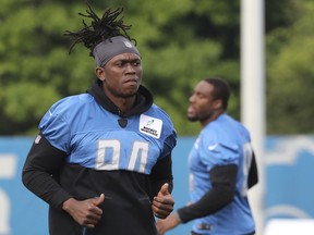 FILE - In this Aug. 1, 2018, file photo, Detroit Lions defensive end Ezekiel Ansah jogs during NFL football practice in Allen Park, Mich. The Detroit Lions have removed defensive end Ziggy Ansah from the active/physically unable to perform list. The Lions announced the move Monday, Aug. 6, 2018.