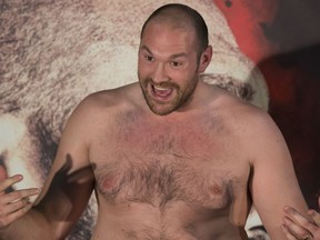 FILE - In this April 27, 2016, file photo, Britain's Tyson Fury gestures during a press conference in Manchester, England. Heavyweight champion Deontay Wilder is on a business trip this weekend in Belfast. He'll be ringside as a TV commentator for Saturday's fight between Tyson Fury and Francesco Pianeta. But even Wilder has something riding on the outcome of this matchup. If Fury wins, Wilder plans to challenge Fury to a fight they've already discussed _ right then and there.