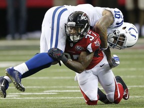File-This Nov. 22, 2015, file photo shows Atlanta Falcons free safety Ricardo Allen (37) tackling Indianapolis Colts wide receiver Donte Moncrief (10) during the second half of an NFL football game, in Atlanta. Tired of pompous, entitled athletes who don't realize how good they have it? Fed up with all the scandals and cheats and scoundrels mucking up things for the rest of us? Meet Ricardo Allen, who gives us all a reason to cheer.
