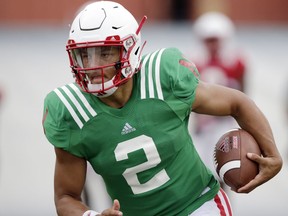 FILE - In this Aug. 8, 2018, file photo, Nebraska quarterback Adrian Martinez (2) runs with the ball during NCAA college football fall practice in Lincoln, Neb. Martinez beat out redshirt freshman Tristan Gebbia for the starter's job and is line to be the first true freshman quarterback to start a season opener in program history. The Cornhuskers open against Akron on Saturday night.