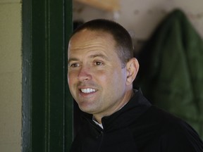 FILE - In this May 1, 2018, file photo, trainer Chad Brown stands in his barn after a morning workout at Churchill Downs, in Louisville, Ky. Brown doesn't mince words when it comes to the Travers Stakes. "It's the biggest race for me. It's my home track.  It would mean ... a lot to me personally to be able to win this race."
