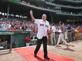 FILE - In this Aug. 20, 2017, file photo, Boston Red Sox broadcaster Jerry Remy waves as he is honored for his 30 years in the broadcast booth at Fenway Park, before a baseball game between the New York Yankees and the Red Sox, Sunday, Aug. 20, 2017, in Boston. Remy is once again battling cancer. NESN announced Remy's latest diagnosis in a statement Tuesday, Aug. 7, 2018. The network says "at this time, Jerry's focus is on his medical treatment." He was not a part of NESN's broadcast team for Tuesday night's game against the Blue Jays.