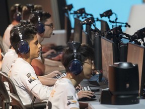 FILE - In this July 28, 2018, file photo, Philadelphia Fusion players compete against the London Spitfire during the Overwatch League Grand Finals at Barclays Center in the Brooklyn borough of New York. The Overwatch League has announced that Atlanta will join the global, city-based esports circuit for its second season in 2019. The team will be managed by Atlanta Esports Ventures, a partnership between Cox Enterprises and Province, Inc.