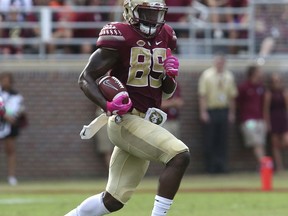 FILE - In this Oct. 7, 2017, file photo, Florida State's Keith Gavin picks up yardage against Miami after making a reception in the second quarter of an NCAA college football game, in Tallahassee, Fla. No. 19 Florida State heads into the season with just two players that have more than 10 college receptions, senior Nyqwan Murray and junior Keith Gavin.