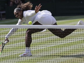 FILE - In this July 14, 2018, file photo, Serena Williams returns the ball to Angelique Kerber during their women's singles final match at the Wimbledon Tennis Championships, in London. Serena Williams was seeded No. 17 for the U.S. Open, higher than her current ranking of No. 26. The U.S. Tennis Association announced the seedings for the main draws of women's and men's singles on Tuesday, Aug. 21, 2018.