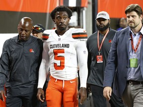FILE - In this Thursday, Aug. 23, 2018, file photo, Cleveland Browns quarterback Tyrod Taylor (5) walks to the locker room during the first half of an NFL preseason football game against the Philadelphia Eagles, in Cleveland. Taylor said on Twitter that he's "doing well" after injuring his left hand against Philadelphia. Taylor got hurt when he fell without contact and landed on his hand and wrist in the first quarter.