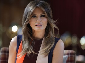 FILE - In a Friday, July 13, 2018 file photo, first lady Melania Trump takes a seat during a visit to The Royal Hospital Chelsea in central London. First lady Melania Trump's move to distance herself from President Donald Trump's criticism of NBA superstar LeBron James was the latest instance of her quiet but seemingly concerted effort to subtly create space between herself and her husband, careful not to criticize him directly while making clear she does not agree with him.