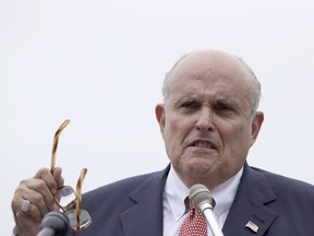 In a Wednesday, Aug. 1, 2018 file photo, Rudy Giuliani, an attorney for U.S. President Donald Trump, speaks during campaign event for Eddie Edwards, who is running for the U.S. Congress in New Hampshire, in Portsmouth, N.H.