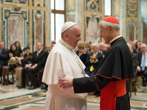 FILE - In this Wednesday, Oct. 20, 2010 file photo, Pope Francis, left, talks with Papal Foundation Chairman Cardinal Donald Wuerl, Archbishop of Washinghton, D.C., during a meeting with members of the Papal Foundation at the Vatican. On Tuesday, Aug. 15, 2018, a Pennsylvania grand jury accused Cardinal Wuerl of helping to protect abusive priests when he was Pittsburgh's bishop. (L'Osservatore Romano/Pool Photo via AP)