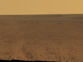 This composite image made from June 7-19, 2017 photos shows the scene from NASA's Opportunity rover outside Endeavor Crater on the planet Mars. Flight controllers have been on the alert for a message from Opportunity ever since a dust storm enveloped Mars in June and contact was lost. The storm has finally diminished in August 2018. (NASA/JPL-Caltech/Cornell/Arizona State University via AP)