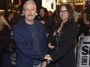 FILE - In this Oct. 12, 2017, file photo, Comedian Jon Stewart and wife Tracey arrive at "Springsteen On Broadway" opening night at the Walter Kerr Theatre in New York. Stewart has made a home for two goats found roaming along the subway tracks in New York City. A train operator on Monday, Aug. 20, 2018, alerted headquarters about "two very baaaaad boys" along the N Line in Brooklyn. The comedian and his wife own Farm Sanctuary, a shelter in Watkins Glen, N.Y.