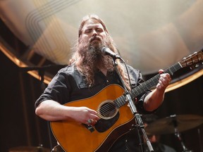 FILE - In this Aug. 22, 2018, file photo, Chris Stapleton performs at the 12th Annual ACM Honors at the Ryman Auditorium in Nashville, Tenn. Stapleton tops the list of finalists with five nominations for the 52nd annual Country Music Association Awards. The nominations were announced Tuesday, Aug. 28, from entertainer Luke Bryan's restaurant and bar in Nashville on ABC's "Good Morning America."