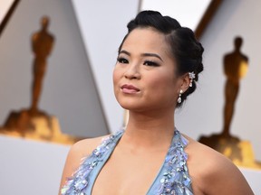 FILE - In this March 4, 2018, file photo, Kelly Marie Tran arrives at the Oscars, at the Dolby Theatre in Los Angeles. Tran is breaking her silence about online harassment months after deleting her Instagram account. In an essay published Tuesday, Aug.  21, in The New York Times, the "Star Wars: The Last Jedi" actress wrote it "wasn't their words, it's that I started to believe them."
