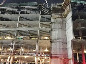 This shows the collapsed scaffolding, top center, at a hotel under construction after two workers fell to their deaths early Wednesday, Aug. 29, 2018, near Orlando, Fla. (Orange County Fire Rescue via AP)