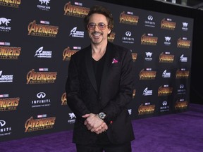 FILE - In this April 23, 2018, file photo, Robert Downey Jr. arrives at the world premiere of "Avengers: Infinity War" in Los Angeles. George Clooney tops the 2018 Forbes' list of highest-paid actors with $239 million in pretax earnings. Downey Jr. was third with $81 million.