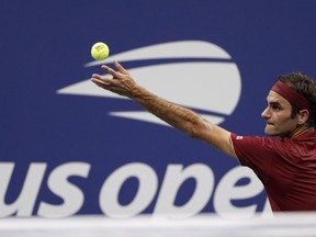 Roger Federer, of Switzerland, serves to Yoshihito Nishioka, of Japan, during the first round of the U.S. Open tennis tournament, Tuesday, Aug. 28, 2018, in New York.
