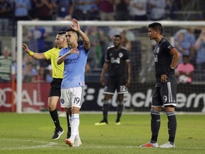 New York City FC's Jesus Medina, second left, celebrates his goal during the first half of an MLS soccer match against Vancouver Whitecaps, Saturday, Aug. 4, 2018, in New York.