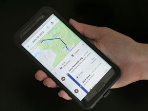 FILE- In this Aug. 8, 2018, file photo a mobile phone displays a user's travels using Google Maps in New York. Days after an Associated Press investigation revealed that Google is storing the locations of users even if they turn a privacy setting called "Location History" off, the company has changed a help page that erroneously described how the setting works.