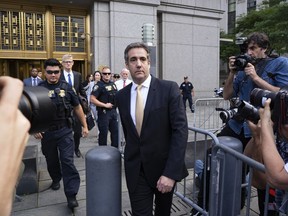 Michael Cohen, former personal lawyer to President Donald Trump, leaves federal court after reaching a plea agreement in New York, Tuesday, Aug. 21, 2018.