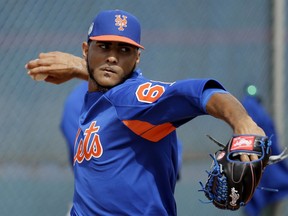 FILE - In this Feb. 15, 2017, file photo, New York Mets pitcher Marcos Molina throws during a spring training baseball workout in Port St. Lucie, Fla. Molina, a free agent since his release from the Mets' Double-A Binghamton farm team on July 14, has been suspended for the rest of the season following a positive test for the performance-enhancing substance Clostebol, the commissioner's office announced Thursday, Aug. 2, 2018.