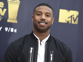 FILE - In this June 16, 2018 file photo, Michael B. Jordan arrives at the MTV Movie and TV Awards in Santa Monica, Calif. Jordan was in Montgomery, Ala., on Monday, Aug. 27, to begin filming "Just Mercy," which is based on the memoir of attorney and criminal justice advocate Bryan Stevenson. He made an impromptu visit with some students from Valiant Cross Academy who were exercising in the midday heat.
