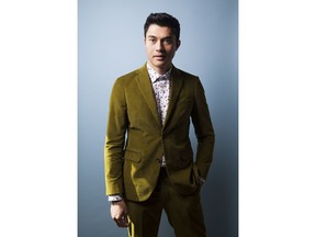 In this Aug 4, 2018 photo, actor Henry Golding poses for a portrait at the Beverly Wilshire Hotel in Beverly Hills, Calif. to promote his film "Crazy Rich Asians."