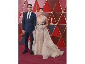 FILE - In this March 4, 2018 file photo, Joe LoCicero, left, and actress Gina Rodriguez arrive at the Oscars in Los Angeles. The couple, who are engaged, met when he was a guest star on "Jane the Virgin."