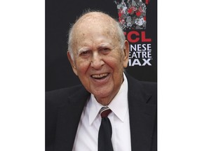 FILE - In this Sept. 8, 2014 file photo, Carl Reiner appears at the TCL Chinese Theatre in Hollywood section of Los Angeles. The 96-year-old creator of "The Dick Van Dyke Show" already has 12 Emmy trophies. He is nominated as narrator of the documentary "If You're Not in the Obit, Eat Breakfast," which looks at how people stay active and vibrant. The Emmy Awards will air Sept. 19 on NBC.