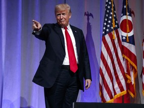 FILE - In this Aug. 24, 2018 file photo, President Donald Trump arrives to speak at the Ohio Republican Party State Dinner in Columbus, Ohio. CNN is sticking by a story casting doubt on President Donald Trump's claim that he did not have prior knowledge of a June 2016 meeting with a Russian lawyer to get damaging information on Hillary Clinton, his Democratic rival at the time.