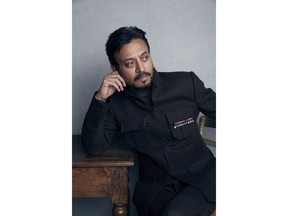 FILE - In this Jan. 22, 2018 file photo, actor Irrfan Khan poses for a portrait to promote the film "Puzzle" during the Sundance Film Festival in Park City, Utah.  Khan has appeared in films such as "Slumdog Millionaire" and "Jurassic World," but now the actor is facing the biggest challenge of his life as he undergoes treatment for cancer in London.