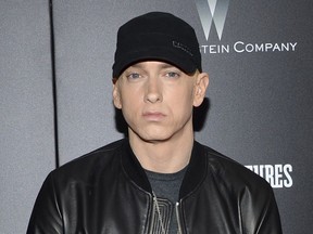 FILE - In this July 20, 2015, file photo, rapper Eminem attends the premiere of "Southpaw" in New York. Eminem released his new album "Kamikaze" on Friday, Aug. 31, 2018.