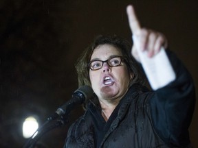 FILE - In this Feb. 28, 2017 file photo, Rosie O'Donnell speaks at a rally calling for resistance to President Donald Trump in Lafayette Park in front of the White House in Washington. O'Donnell and cast members from some of Broadway's biggest musicals led a sing-along protest against Trump outside the White House on Monday, Aug. 6, 2018.