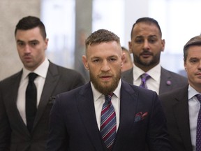 FILE - In this July 26, 2018, file photo, mixed martial arts fighters Conor McGregor leaves the courthouse following a hearing in New York. McGregor will return to mixed martial arts on Oct. 6 in Las Vegas with a bout against UFC lightweight champion Khabib Nurmagomedov. The UFC dramatically announced the matchup Friday, Aug. 3, to close a news conference promoting the slate of fight cards for the rest of 2018.