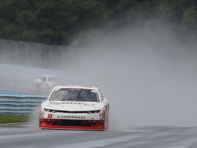AJ Allmendinger (23) accelerates onto a straightaway after a brief rain shower during a NASCAR auto race, Saturday, Aug. 4, 2018, in Watkins Glen, N.Y.
