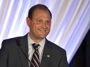 FILE- In this Aug. 25, 2018, file photo Rep. Andy Barr, R-Ky., addresses the audience during the Republican Party's Lincoln Dinner in Lexington, Ky. The White House announced recently that Trump plans to visit Kentucky ahead of the November midterm election. The state is home to a closely watched congressional race in the 6th District between Barr and Democrat Amy McGrath, a retired fighter pilot.