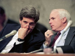 FILE - In this Dec. 1, 1992, file photo, Sen. John Kerry, D-Mass., left, chairman of the Senate Select Committee on POW/MIA Affairs, listens to Sen. John McCain, R-Ariz., a former POW in Vietnam, during a hearing of the committee on Capitol Hill in Washington. Arizona Sen. McCain, the war hero who became the GOP's standard-bearer in the 2008 election, has died. He was 81. His office says McCain died Saturday, Aug. 25, 2018. He had battled brain cancer.