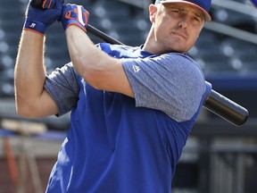 New York Mets' Jay Bruce warms up before a baseball game against the Washington Nationals, Friday, Aug. 24, 2018, in New York.