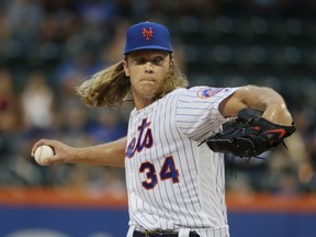 New York Mets' Noah Syndergaard delivers a pitch during the first inning of the team's baseball game against the San Francisco Giants on Wednesday, Aug. 22, 2018, in New York.