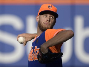 New York Mets pitcher Zack Wheeler delivers the ball to the Washington Nationals during the fourth inning of a baseball game Saturday, Aug. 25, 2018 in New York.