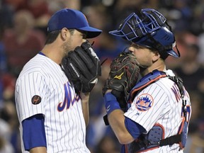 New York Mets relief pitcher Anthony Swarzak, left, talks with catcher Devin Mesoraco during the ninth inning of the team's baseball game against the Atlanta Braves on Friday, Aug. 3, 2018 in New York.the Braves won 2-1.
