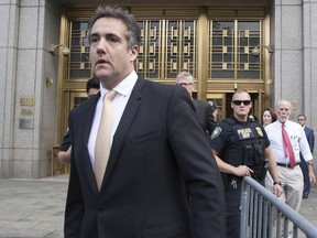 Michael Cohen leaves Federal court, Tuesday, Aug. 21, 2018, in New York. Cohen, has pleaded guilty to charges including campaign finance fraud stemming from hush money payments to porn actress Stormy Daniels and ex-Playboy model Karen McDougal.
